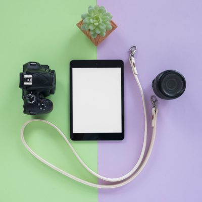 digital-tablet-with-blank-screen-camera-camera-lens-belt-succulent-plant-dual-background